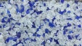Decorative small blue and white shards of glass, close-up Royalty Free Stock Photo