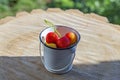 Decorative small bucket with cherries as an interior object Royalty Free Stock Photo