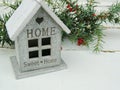 Decorative small house with sign Sweet home on white vintage background. Royalty Free Stock Photo