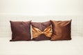 Decorative small pillow on the bed Royalty Free Stock Photo
