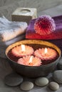 Decorative spa still life with candles, soap, flower and towels Royalty Free Stock Photo