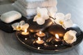 Decorative spa still life with soap, towels, orchid flowers and candles Royalty Free Stock Photo