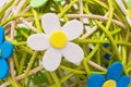 Decorative sphere made of bound wicker with florets