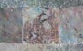 Decorative square-shaped paving tiles. Background, textures imitating natural stone