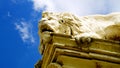 Decorative statues on the facade of the Rome zoo known as Bioparco, with the coat of arms of the municipality and the inscription