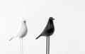 Decorative statuettes of white and black birds in the interior of the house