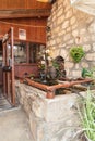 Decorative stone aquarium with a small waterfall and goldfish in the famous artists village Ein Hod near Haifa in northern Israel