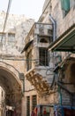 Decorative stone external balcony on the wall of a building on the Shaar ha-Shalshelet Street in the old city of Jerusalem in