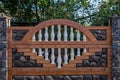 Brown decorative stone fence with baluster. against the green Royalty Free Stock Photo