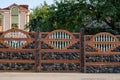 Brown decorative stone fence with baluster. against the house Royalty Free Stock Photo