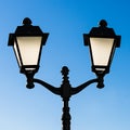 Decorative street lamp and blue sky Royalty Free Stock Photo