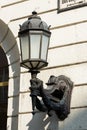 Decorative street lamp mounted on the facade of the building Royalty Free Stock Photo