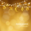 Decorative string. Hanging moon, stars, balls. Festive golden glitter blurred background.Ramadan Kareem greeting card