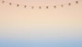 Decorative String Lights Hanging Against Sunset Gradient Sky Royalty Free Stock Photo