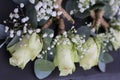 Decorative table arrangement featuring several wedding boutonnieres, accented with vibrant flowers Royalty Free Stock Photo