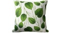 Decorative throw pillow featuring a vibrant green leaf and branch pattern on a white background Royalty Free Stock Photo