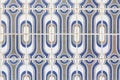 Decorative tiles azulejos in white and blue colours. Fragment of old building wall, with traditional Portuguese, glazed ceramic ti