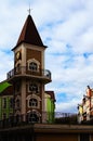 Decorative tower with clock against cloudy sky. Modern architecture of new neighborhood in Kyiv downtown Royalty Free Stock Photo