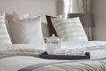 Decorative tray of tea set on the bed in modern bedroom Royalty Free Stock Photo