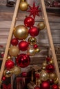 Decorative triangular Christmas tree of boards with balls. Christmas festive decorations Royalty Free Stock Photo