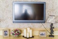 Decorative unlit candles and TV in restaurant Royalty Free Stock Photo