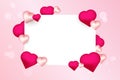 A decorative Valentine-themed design with a rectangular white frame surrounded by pink and red hearts of various sizes, set on a Royalty Free Stock Photo