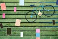 Decorative vintage blue bicycle and blank colorful frames hanging on the wooden fence Royalty Free Stock Photo