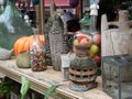 Decorative vintage stuff at flea market - bottles, clocks, lamps