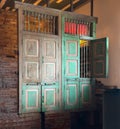 Decorative wall constructed of antique cabinet doors Royalty Free Stock Photo