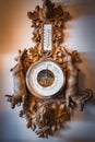 Traditional German Weather Station with Barometer, Thermometer, and Intricate Wooden Carvings Royalty Free Stock Photo