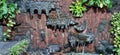 Decorative walls made of concrete formed into stone for the flow of water with steps and plants decorating it.