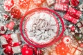 Decorative wands, with decorative Xmas plate and biscuits, cookies inside, on gray, stone, marble background