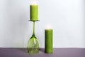 Decorative wax candles and wineglass