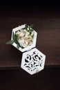 Decorative wedding box with gold wedding rings, decorated with flowers and grass Royalty Free Stock Photo