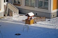 Decorative well in the territory of kindergarten. Winter frosty day.