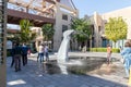 The decorative whale tail fountain on the Pointe - seaside promenade of the Palm Jumeirah island in Dubai city, United Arab