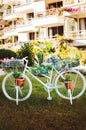 Decorative white bike with flower pots Royalty Free Stock Photo