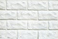 Decorative white brick wall, plaster light background, building wall