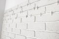 Decorative white bricks with tile leveling system on wall Royalty Free Stock Photo