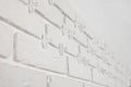 Decorative white bricks with tile leveling system on wall Royalty Free Stock Photo