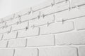 Decorative white bricks with tile leveling system on wall Royalty Free Stock Photo