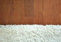 Decorative white fur carpet on wood floor
