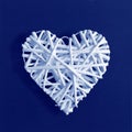 Decorative white heart on grey canvas texture background made of Classic Blue 2020 color. Color of year 2020 blurred sparkling