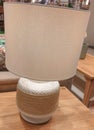 Decorative white table lamp on sidetable