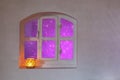 Decorative window with purple glow outside