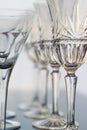 Decorative wine and martini glasses are set up in verticle rows displaying beautiful details of the glass