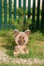 Decorative wooden bear made of tree stumps.