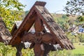 Decorative wooden carved cross with Romanian traditional motifs, Maramures, Romania