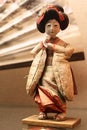 Decorative wooden chinese woman doll with thick clothes looking like pillows.