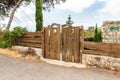 Decorative wooden fence and gate made by a local artist in the famous artists village near Haifa in northern Israel